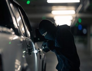 A person breaking into a car